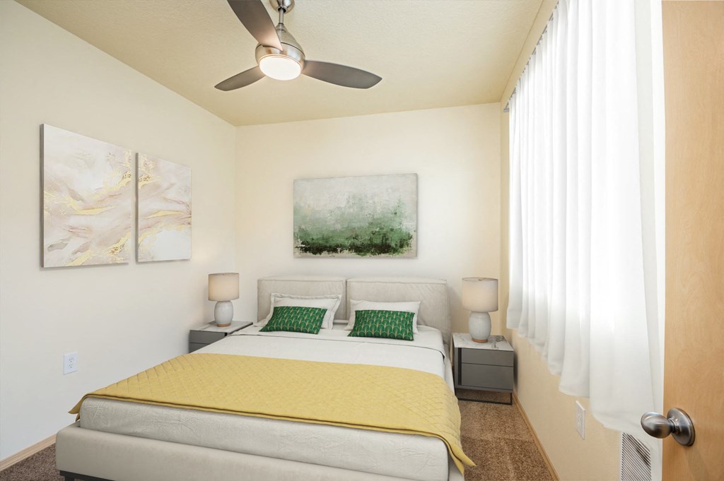 a bedroom with a bed and a ceiling fan