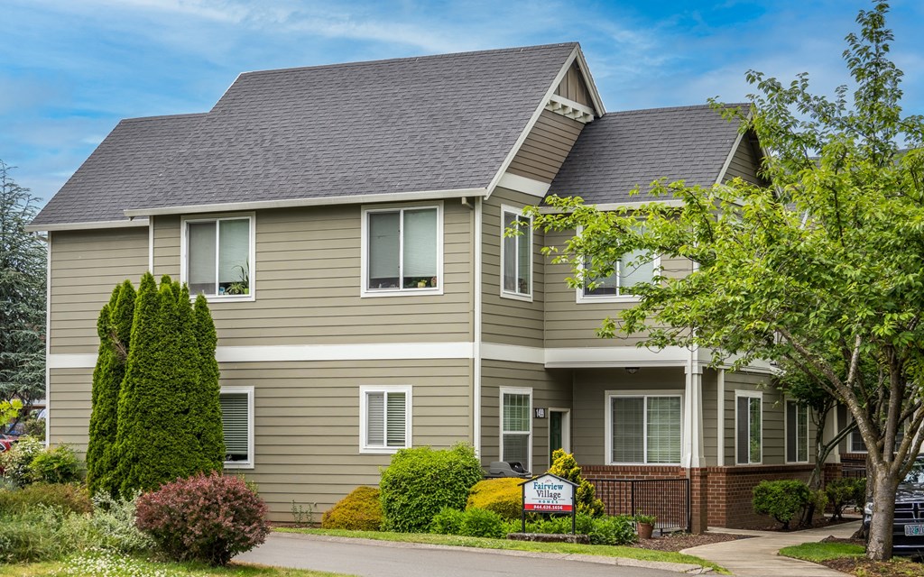 a house with a sign in front of it