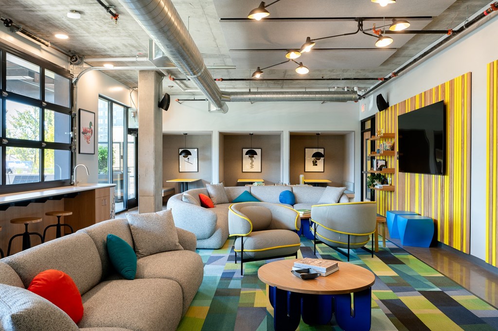 a resident lounge  with couches and chairs and a table