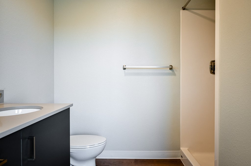 an empty bathroom with a toilet and a sink