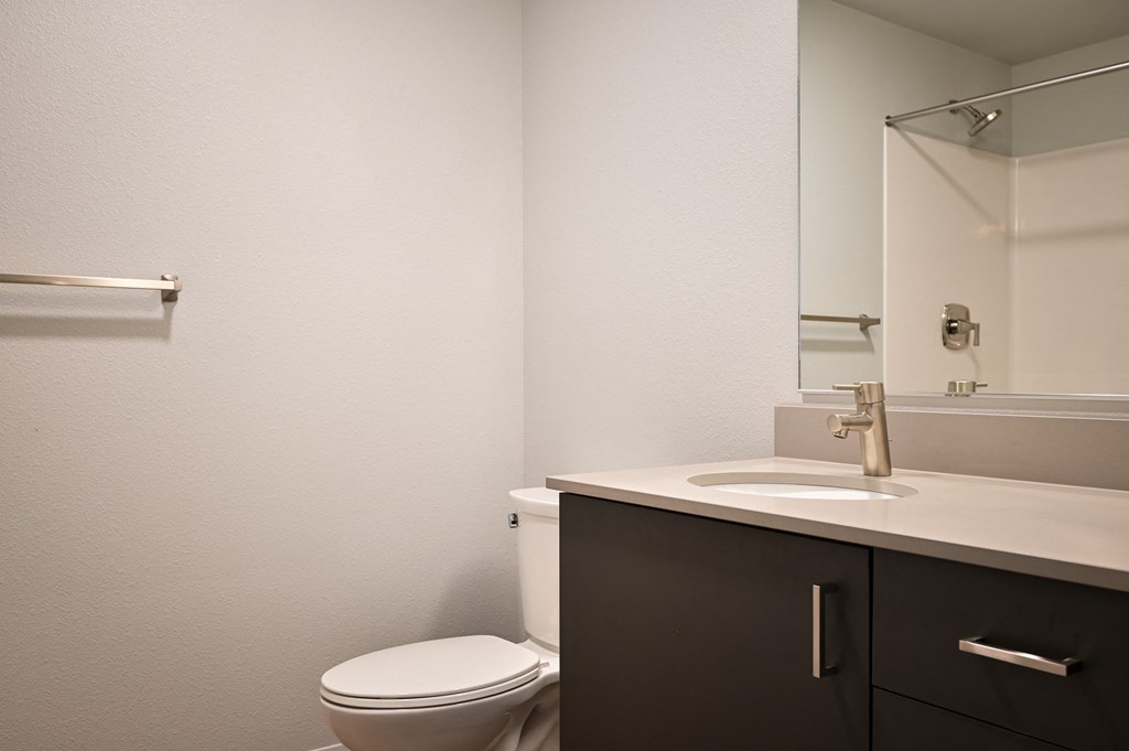 an empty bathroom with a toilet and a sink