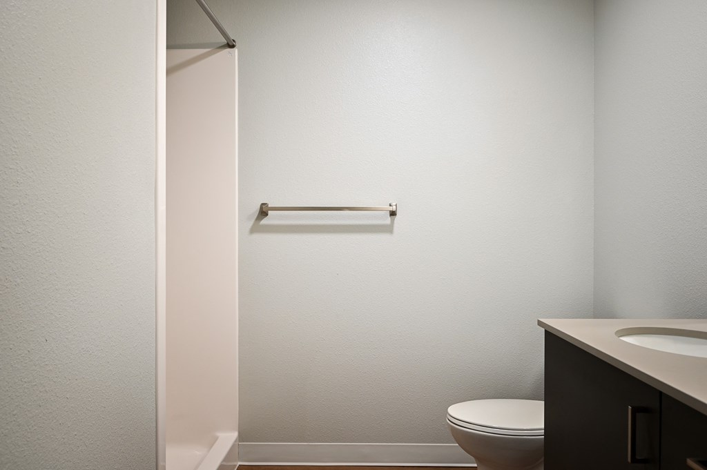 an empty bathroom with a toilet and a sink