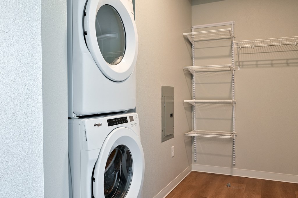 a washer and dryer in a laundry room with a closet