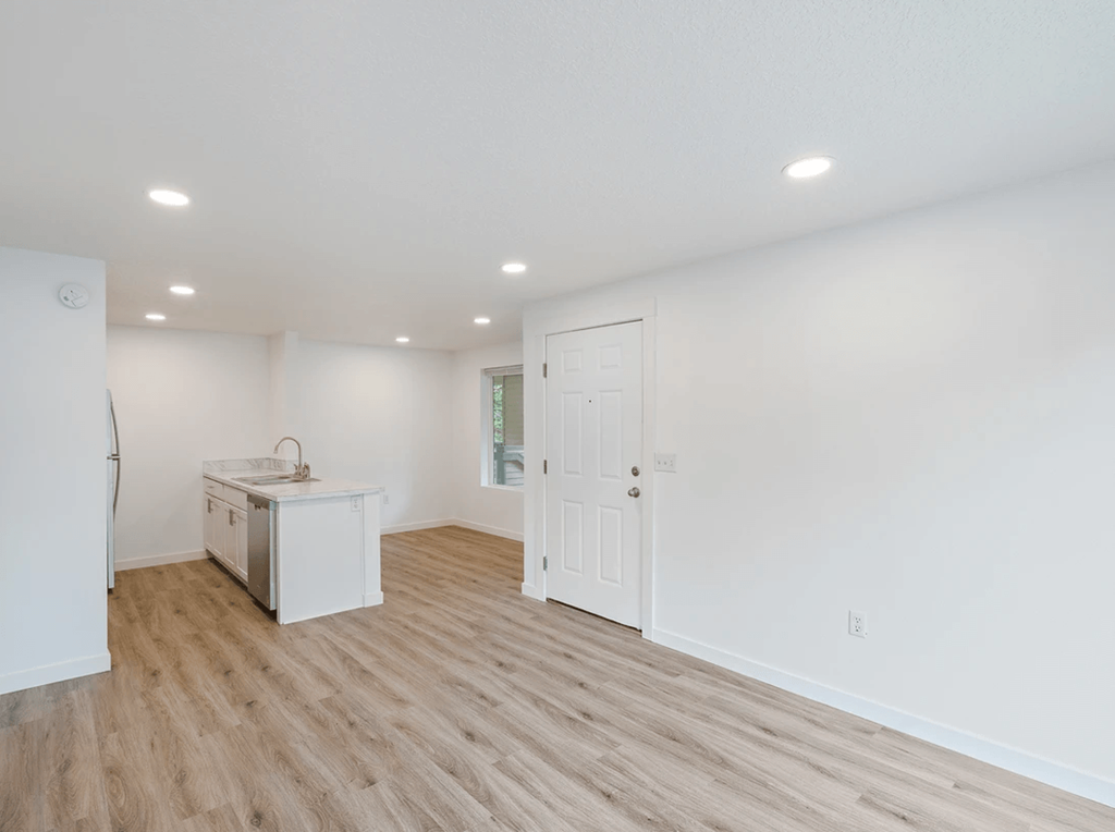 a kitchen and living room in a 555 waverly unit