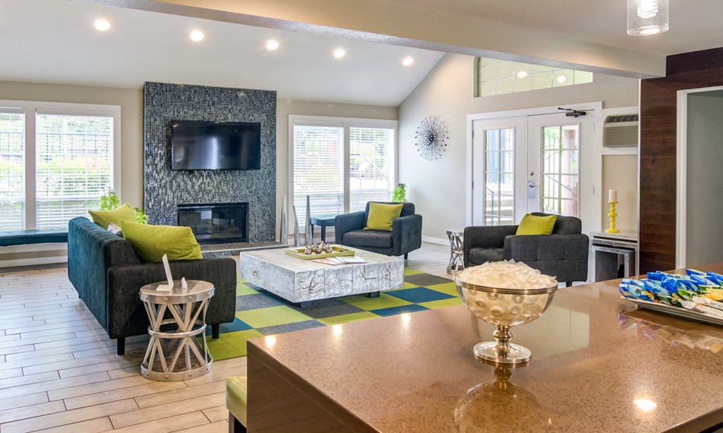 the preserve at ballantyne commons clubhouse with living room and fireplace