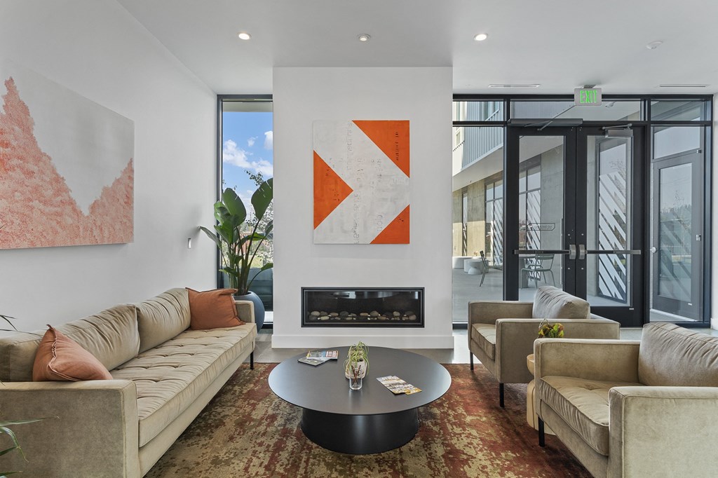 a living room filled with furniture and a fire place