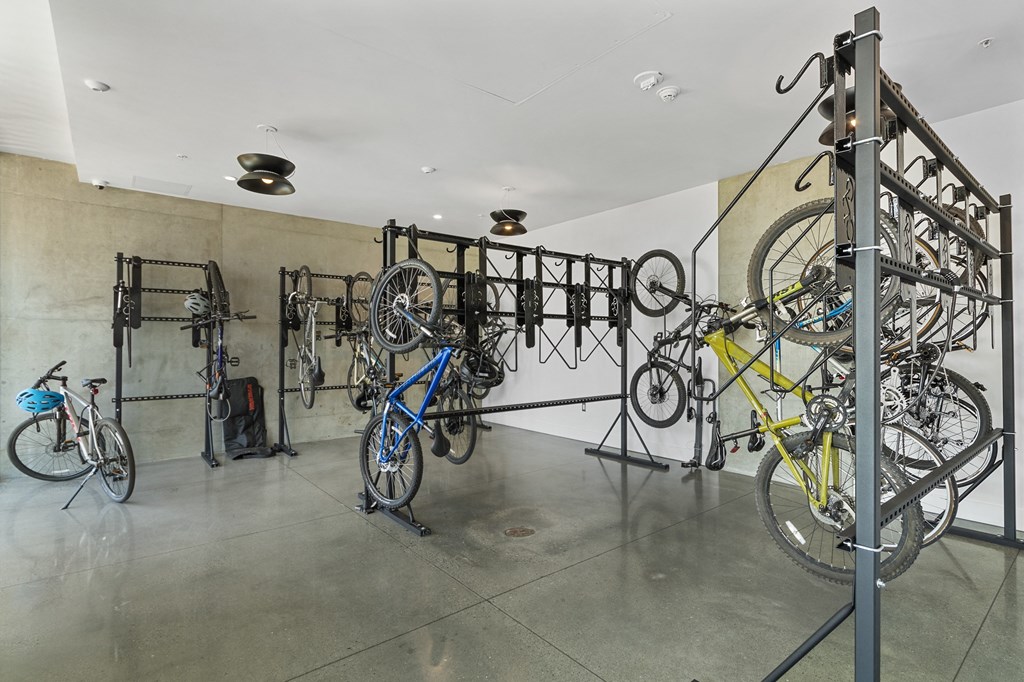 a bike rack with several bikes hanging on it