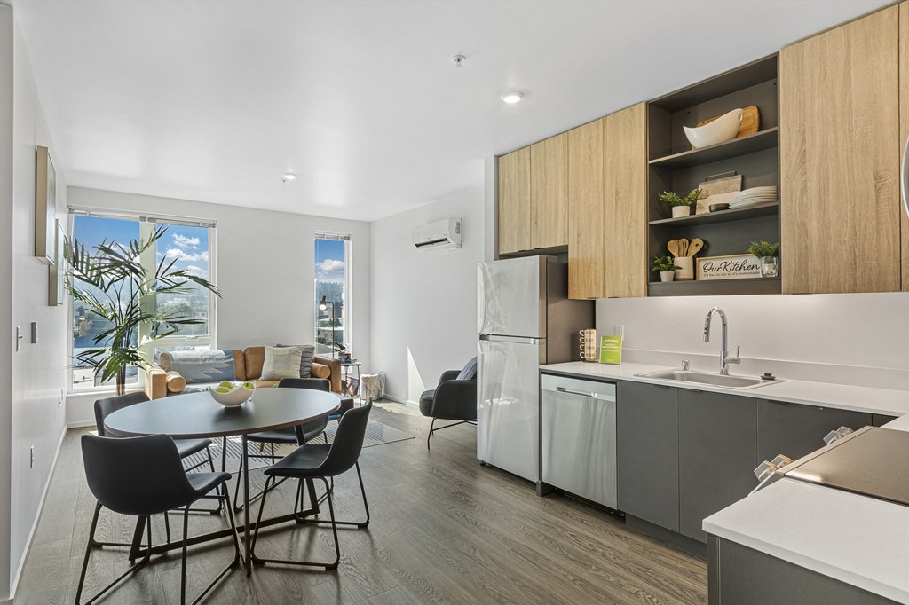 a kitchen and dining area in a 555 waverly unit