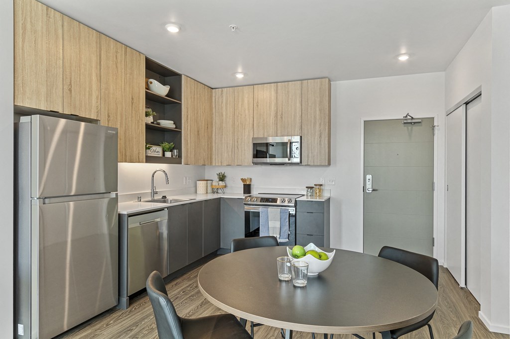 a kitchen and dining area in a 555 waverly unit