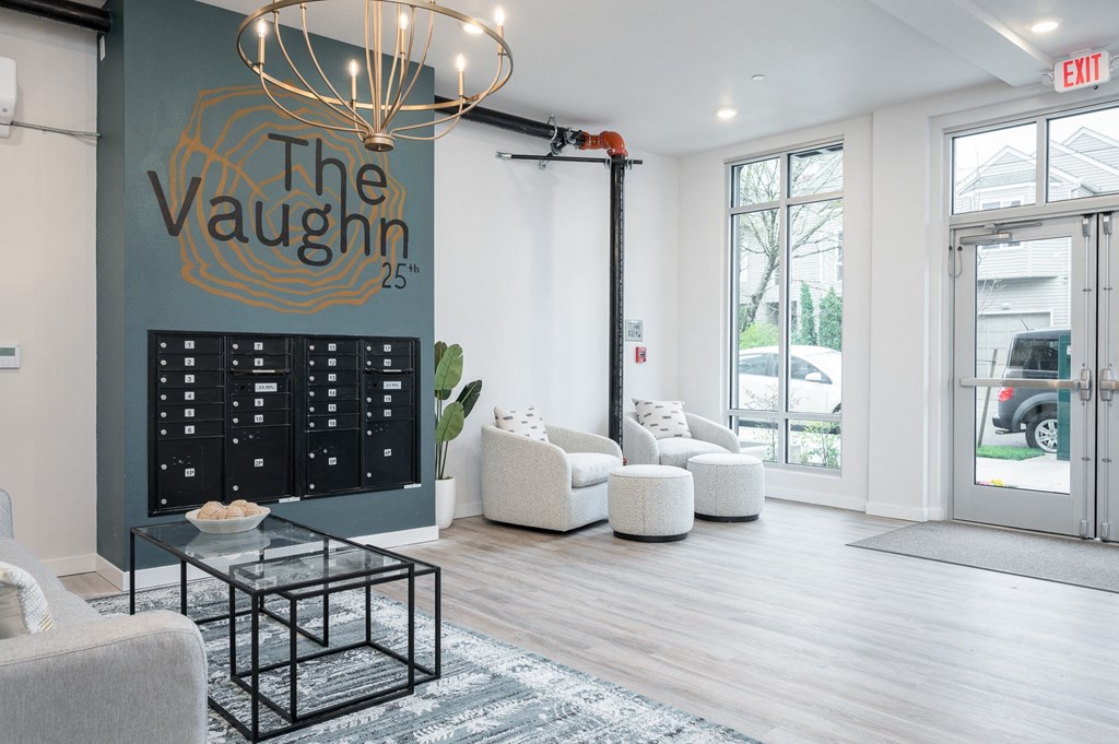 a view of the lobby at the vanguard with couches and chairs