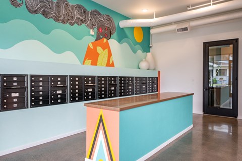 a mural of a woman on the wall behind a desk