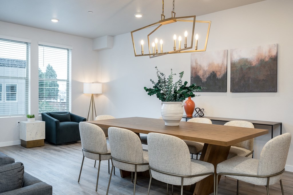 our apartments offer a living room with a sofa and a dining table