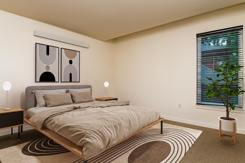 a bedroom with a bed and a large window