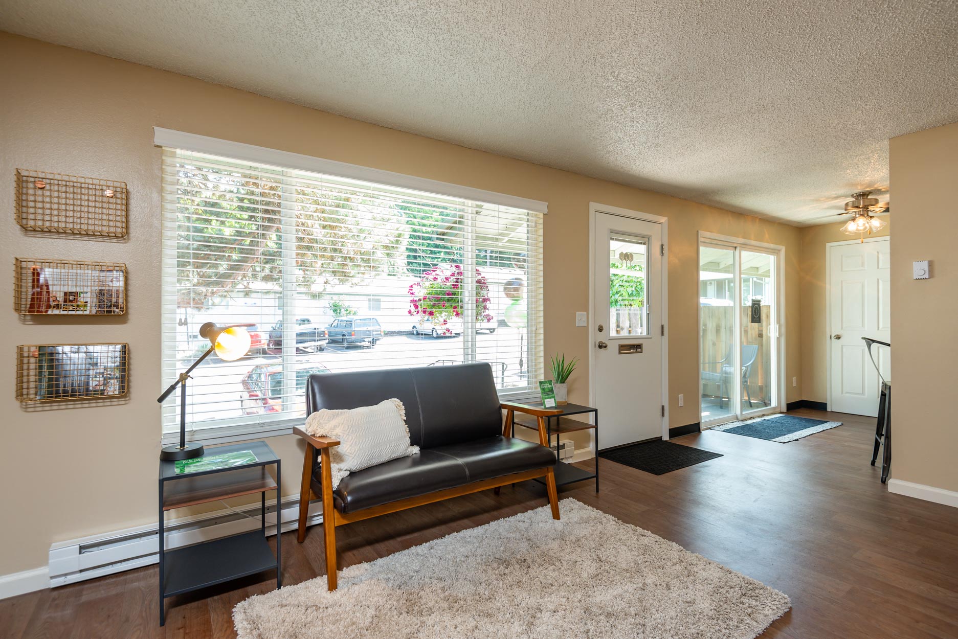 a living room with a couch and a large window