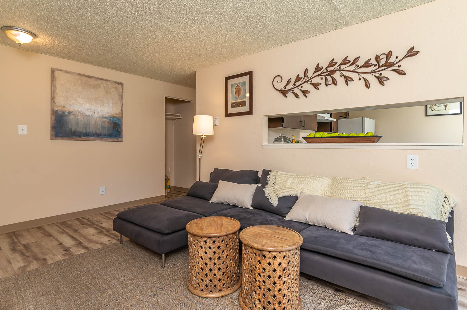 a living room with a couch and two tables