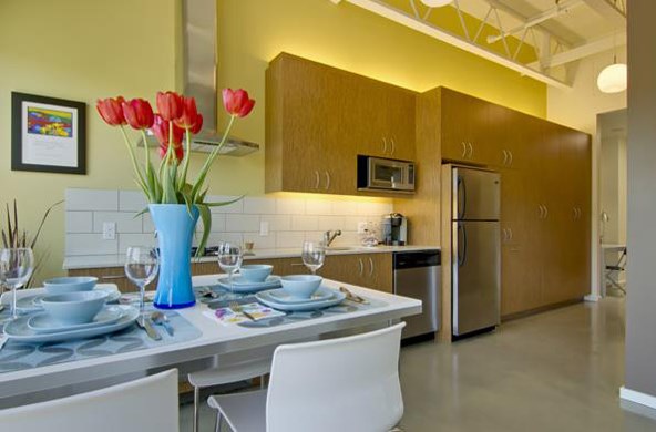 a dining room with a table and chairs