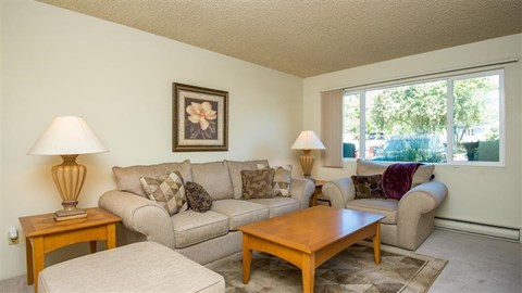 a living room with a couch and a table