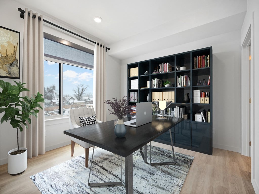 a home office with a desk and a laptop computer