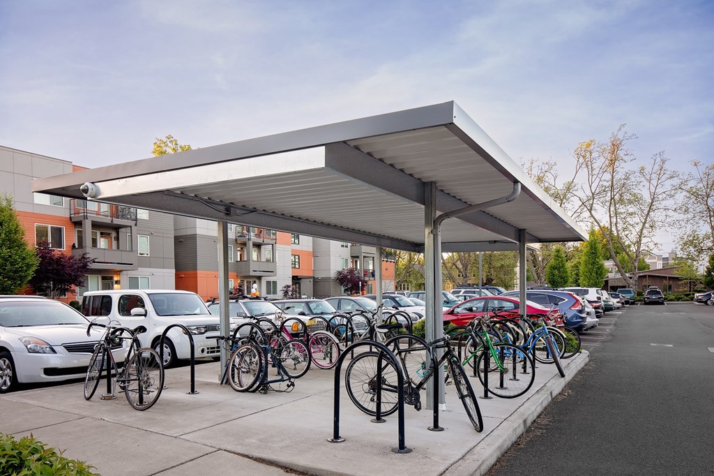 Corvallis, OR Apartments - Exterior View of The Quad near OSU - Apartments Building Surrounded By Lush Landscaping with View of Outdoor Lounge