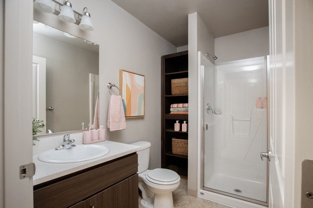 The Quad near OSU - Apartments in Corvallis, OR with wall to wall carpet, white walls, and access to the bathroom