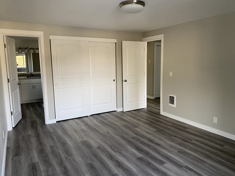 A room with a grey floor and white walls.