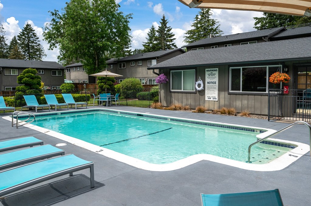 a swimming pool in front of a house
