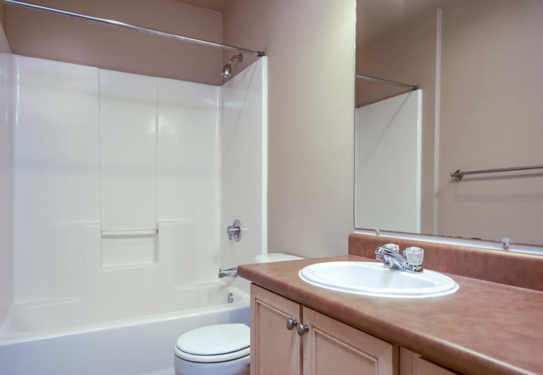 Southside Townhome | Bathroom with Wood Cabinetry