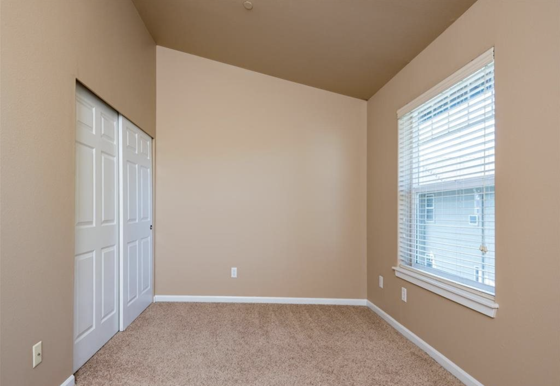 Southside Townhome | Bedroom with Light Filled Windows and Closet