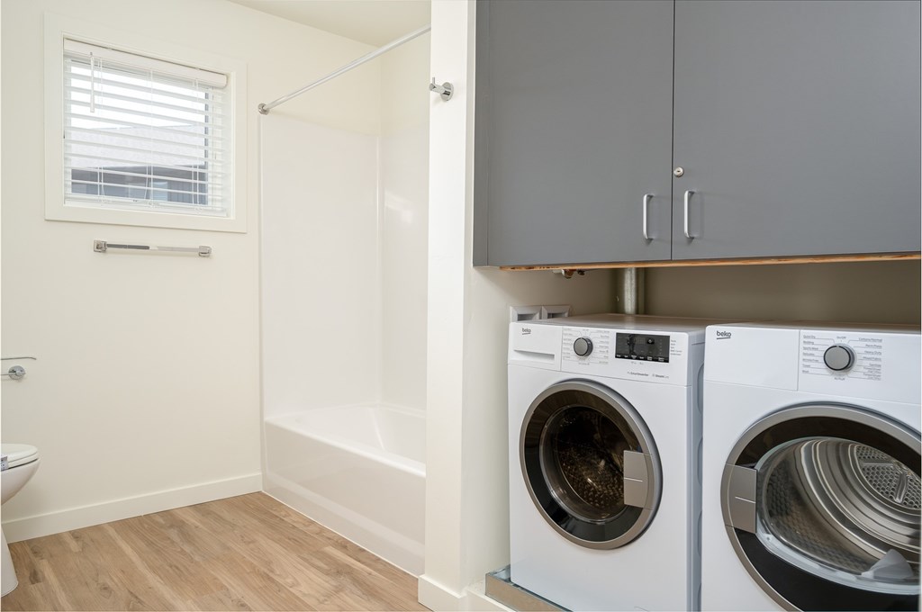 A laundry room with a washer and dryer.