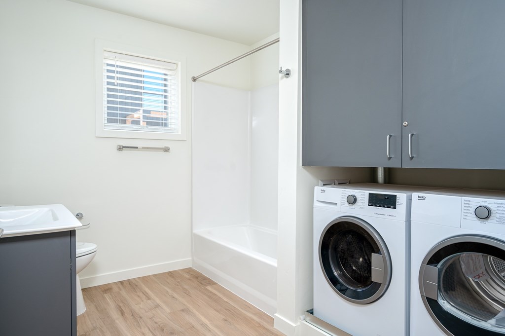 A laundry room with a washer and dryer.