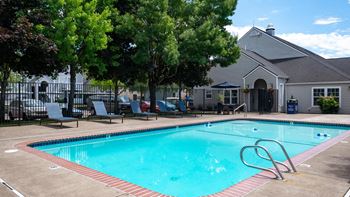 the swimming pool at the resort on a sunny day