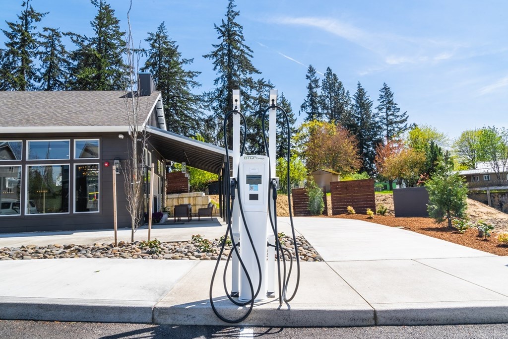A charging station for electric vehicles is located outside a building.