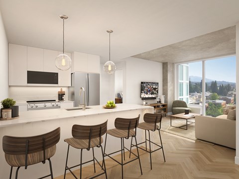 A modern kitchen with a bar area and a view of the city.