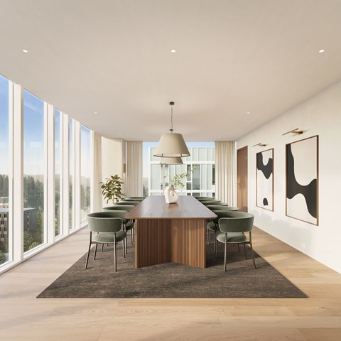 A modern dining room with a long table and chairs.