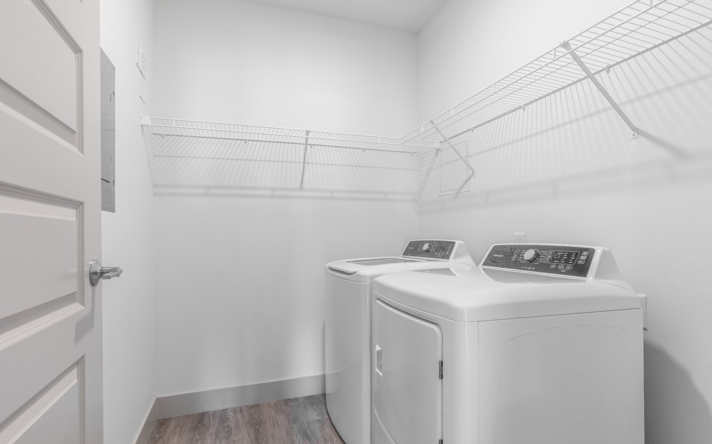 A laundry room with a washer and dryer.