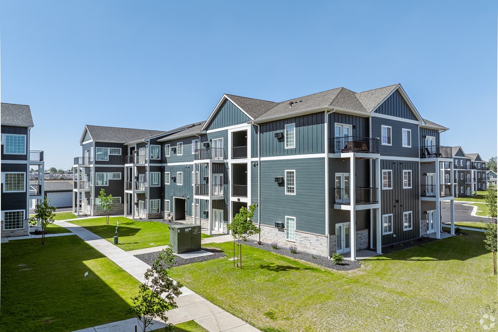 a bedroom with a bed and a ceiling fan