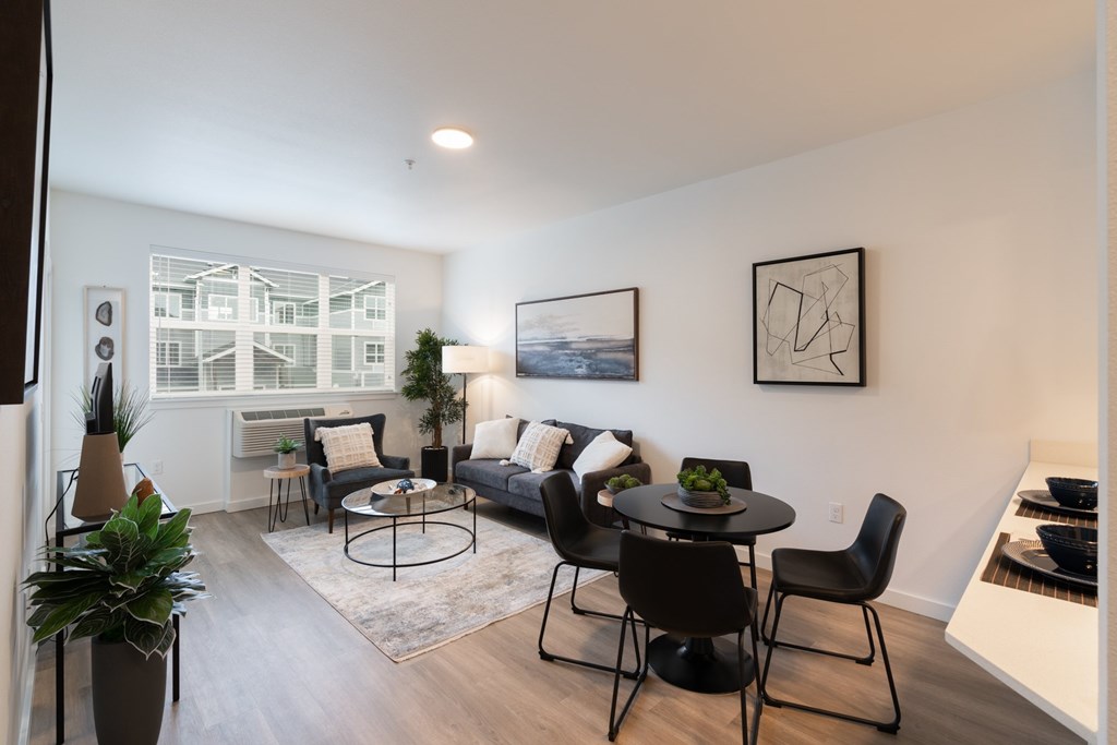 A living room with a black and white color scheme.