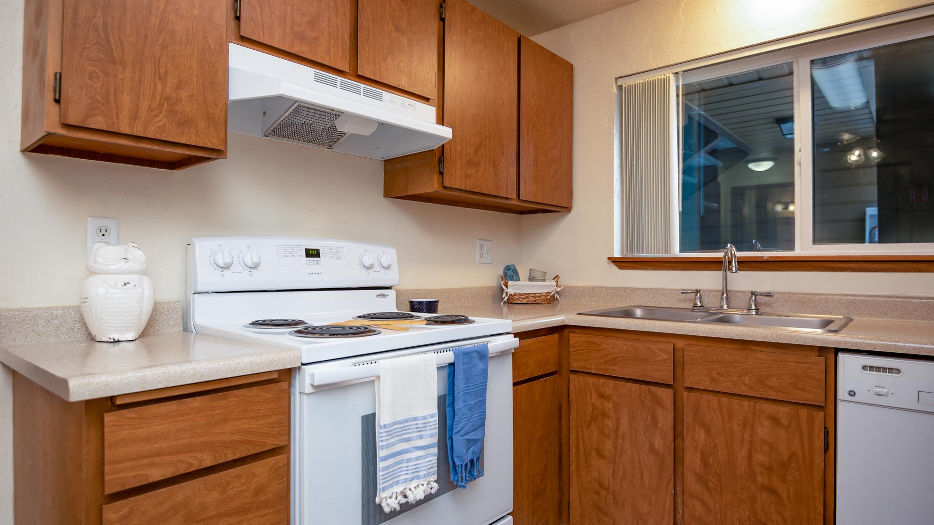 Broadway Center | Kitchen with Wood Cabinetry and Light Filled Window