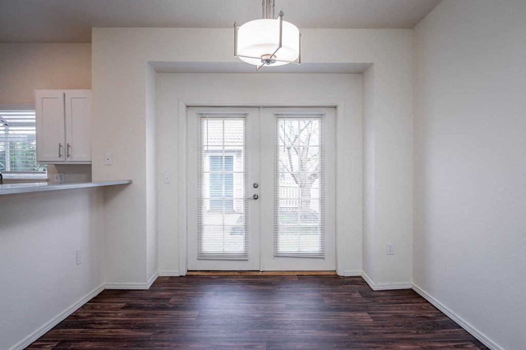 Village at Main Street | 2x2 Dining Room with Plank Like Flooring and Pendant Lighting