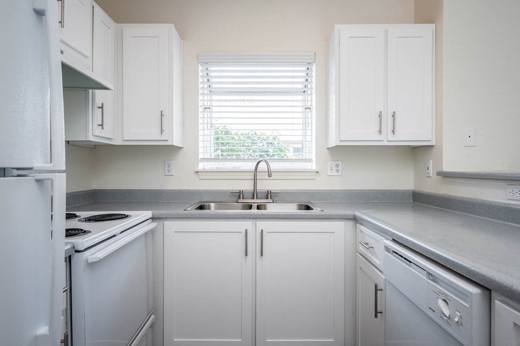 Village at Main Street | 2x2 Kitchen with White Cabinetry and Appliances and Ample Counter Space