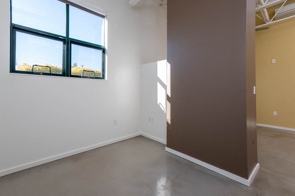 an empty room with a window in it