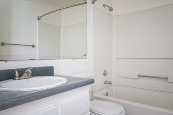 a bathroom with a sink toilet and bathtub - Photo Gallery 21