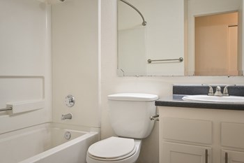 a bathroom with a toilet sink and bathtub - Photo Gallery 24