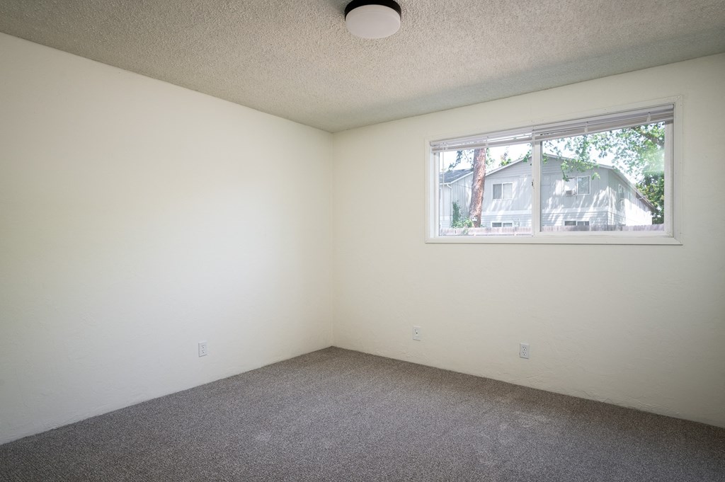 an empty room with a window in it