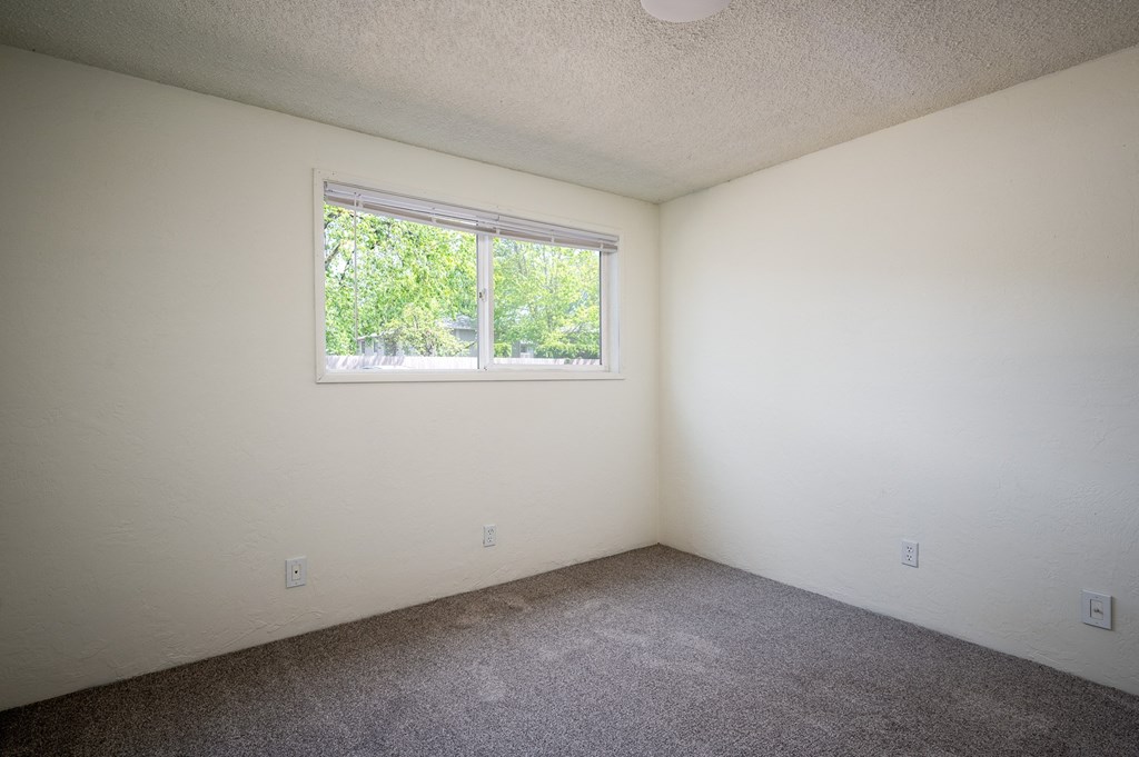 an empty room with a window in it