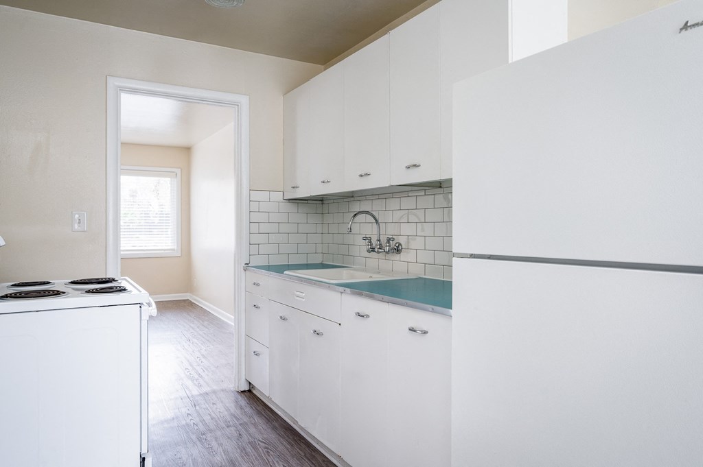 Clinton Court| Kitchen with White Cabinets