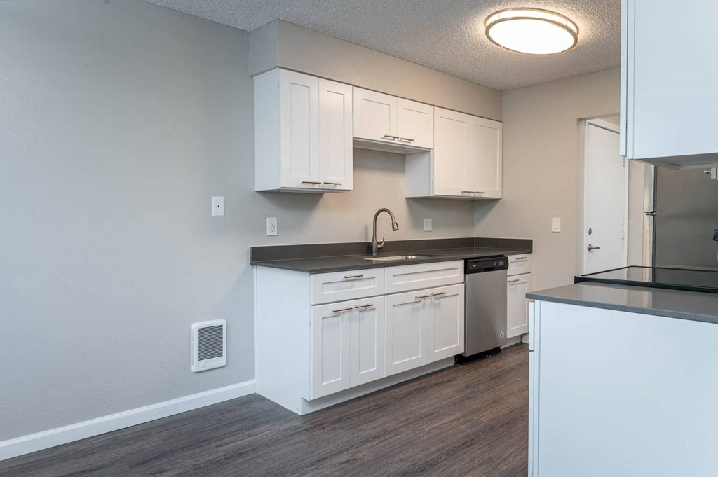 Vantage at Hillsdale | #3 Kitchen with White Cabinetry and Black & Stainless Steel Appliances
