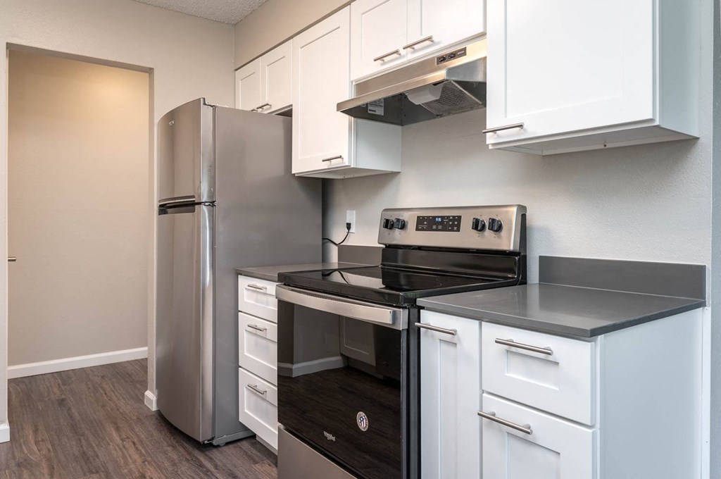 Vantage at Hillsdale | #3 Kitchen with White Cabinetry and Black & Stainless Steel Appliances