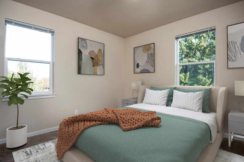 a bedroom with a bed and two windows