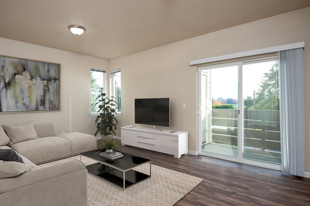 a living room with a couch and a coffee table and a television